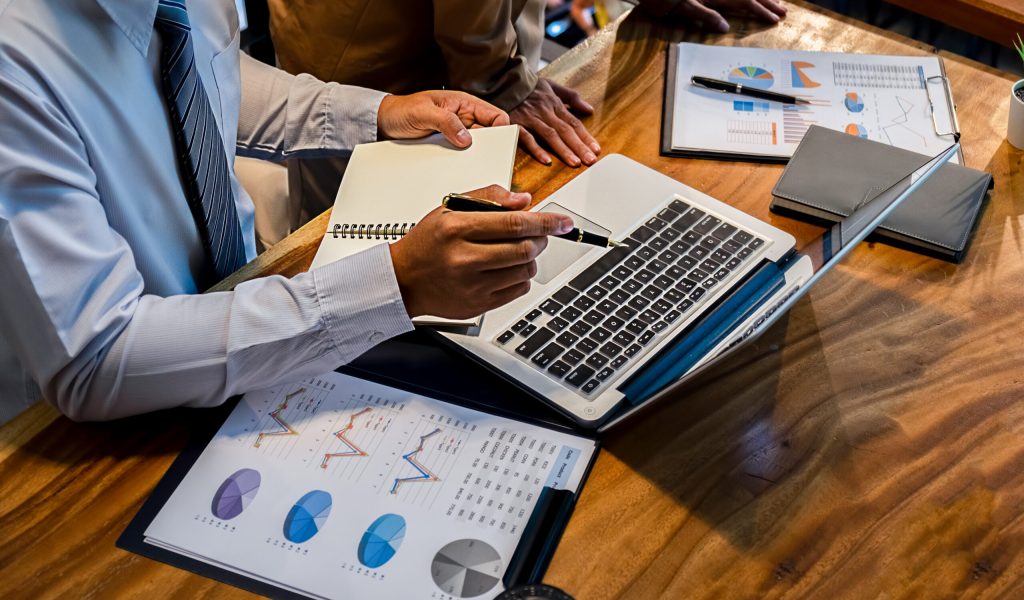 Administrator business man financial inspector and secretary making report calculating balance. Internal Revenue Service checking document. Audit concept